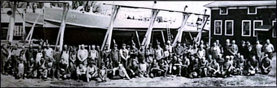 Workers at the Shelburne Shipyard posing in front of the PT Boats