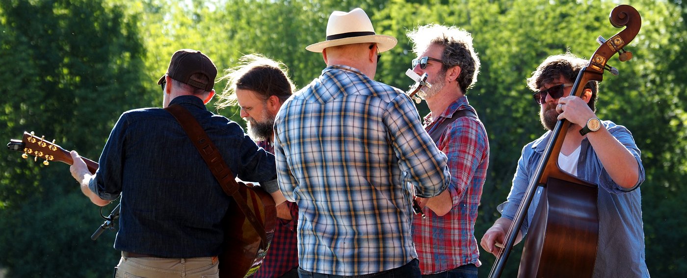 Bluegrass band performing in golden light on the Parade Grounds
