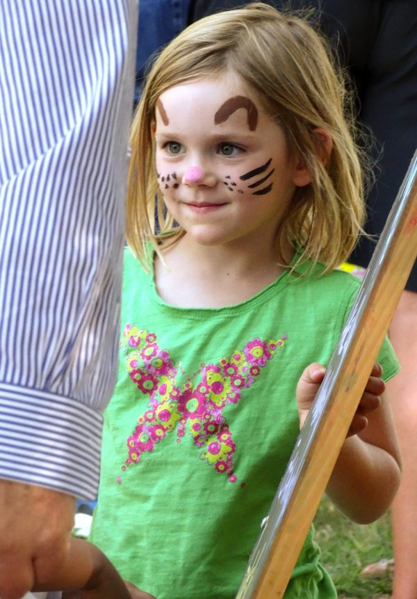 Girl with face painting at the farmers market